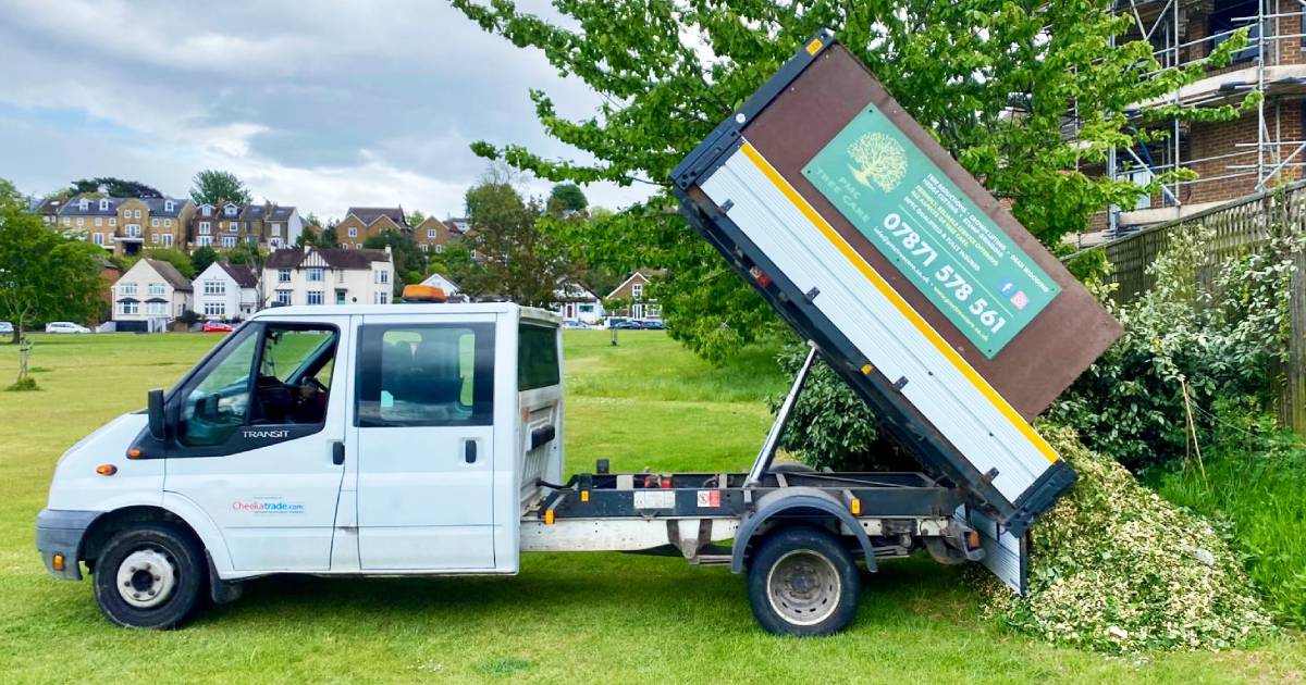 A pick up truck from donors PMC Tree Care delivers a pile of sycamore mulch, ready for distribution along the hedgerow