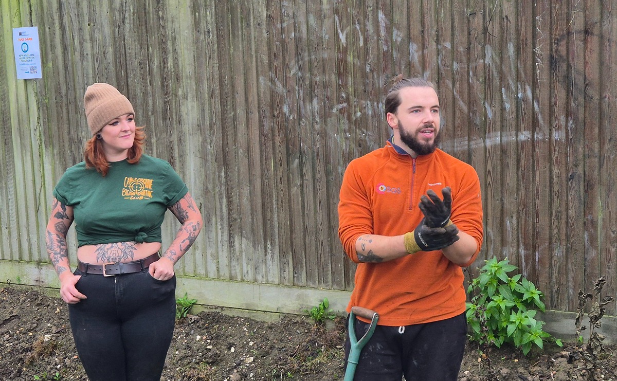 Aidan and Megan from Sustainable Garden Solutions demonstrating to our volunteers how to plant the whips that will grow into the hedgerow