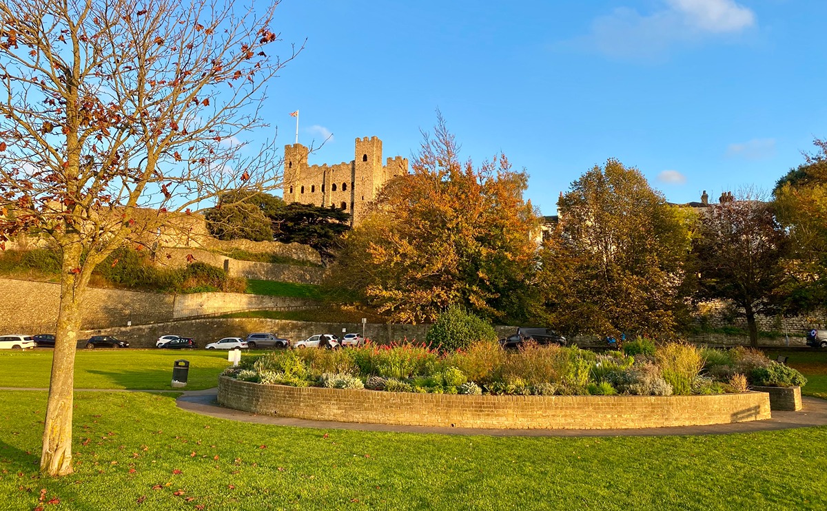 An autumnul view of the Sensory Garden with Rochester Castle in the background